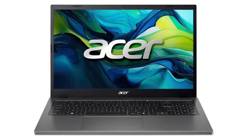 Notebook intermediário Acer Aspire Go 15 de cor cinza escuro aberto de frente, com a tela ligada exibindo o papel de parede colorido oficial da marca e teclado padrão ABNT2 com teclado numérico.
